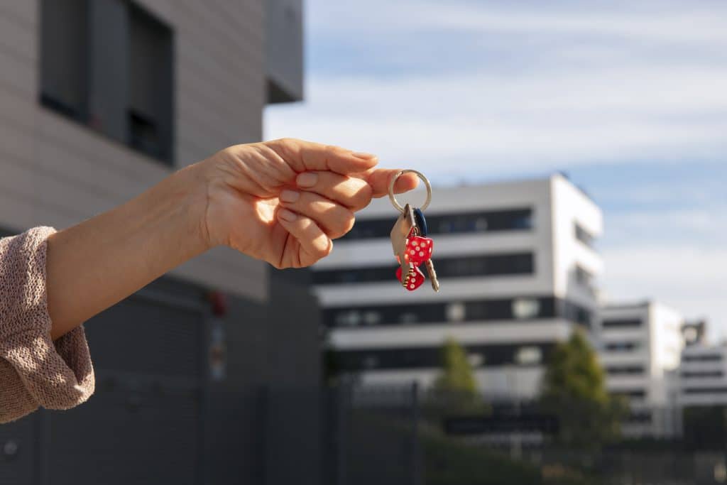 hand-holding-keys-outdoors